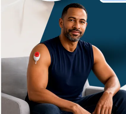 Patient using an at-home blood collection device on the upper arm